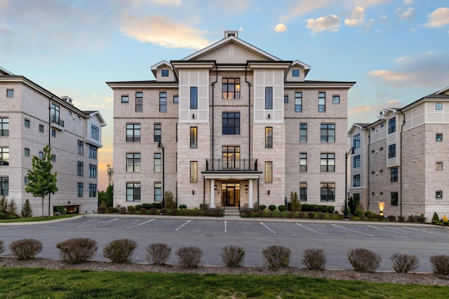 view of outdoor building at dusk