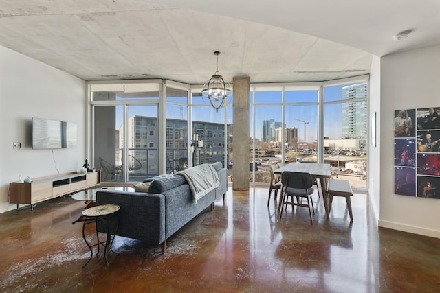 living area with a view of city, a wall of windows, and a wealth of natural light