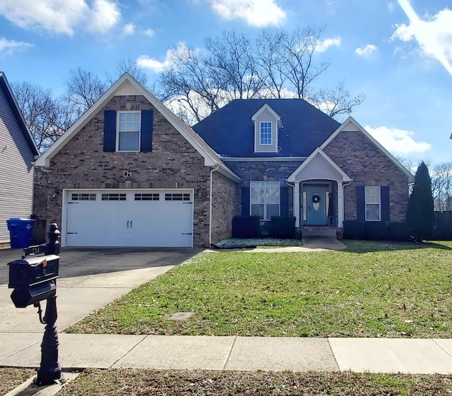 view of property featuring a garage and a front yard