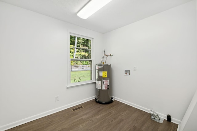 6992 Mill Creek Rd, Lyles, TN 37098 - washroom featuring laundry area, washer hookup, baseboards, water heater, and dark wood finished floors