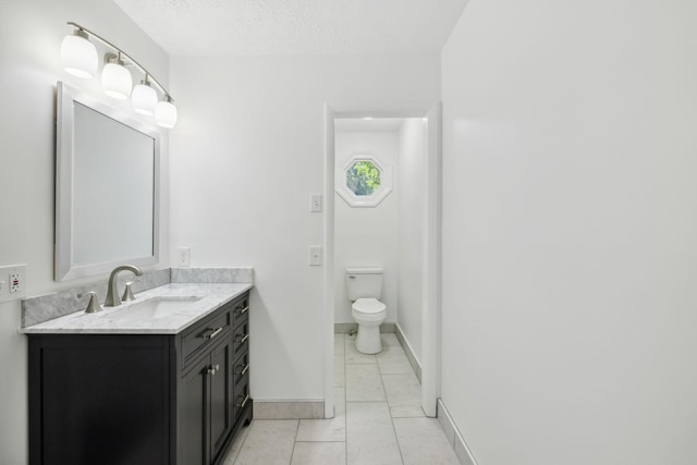 6992 Mill Creek Rd, Lyles, TN 37098 - bathroom featuring baseboards, toilet, tile patterned floors, a textured ceiling, and vanity