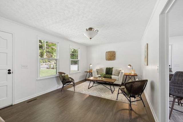 6992 Mill Creek Rd, Lyles, TN 37098 - living area featuring baseboards, visible vents, dark wood-style flooring, crown molding, and a textured ceiling