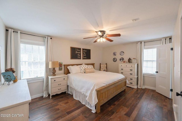 bedroom with dark hardwood / wood-style floors and ceiling fan