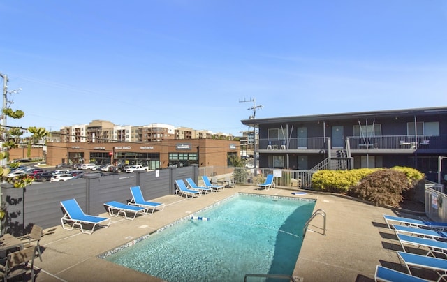 view of swimming pool with a patio area