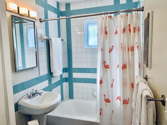 bathroom featuring sink and shower / bath combo with shower curtain