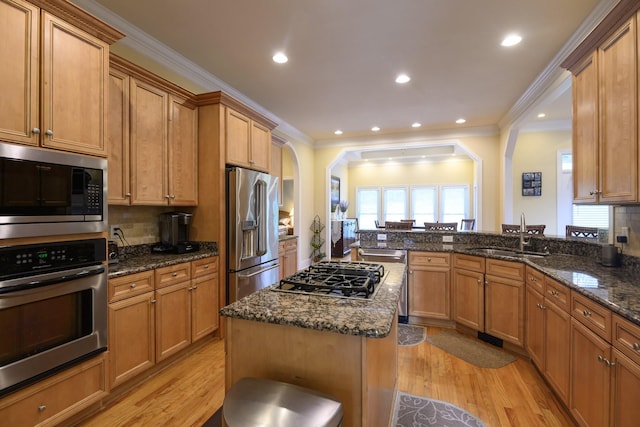 1416 Station Four Ln, Old Hickory, TN 37138 - kitchen featuring sink, a center island, light wood-type flooring, appliances with stainless steel finishes, and dark stone counters