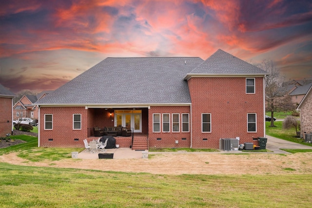 1416 Station Four Ln, Old Hickory, TN 37138 - back house at dusk with a patio, a yard, and central AC unit