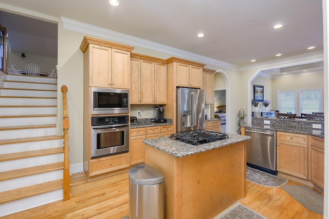 1416 Station Four Ln, Old Hickory, TN 37138 - kitchen featuring stainless steel appliances, a kitchen island, light brown cabinets, and dark stone counters
