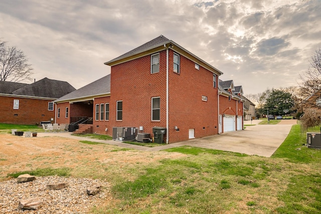 1416 Station Four Ln, Old Hickory, TN 37138 - rear view of property with a garage, a yard, and central AC unit