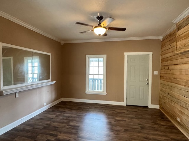 entrance foyer featuring ornamental molding, dark wood-type flooring, and ceiling fan