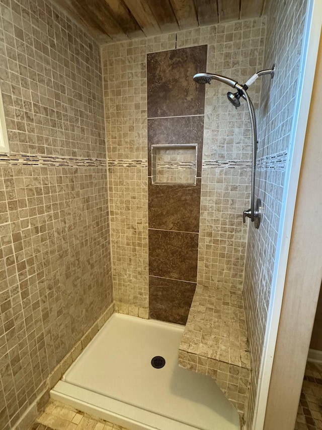 bathroom with a tile shower