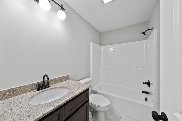 full bathroom with shower / tub combination, vanity, toilet, and a textured ceiling