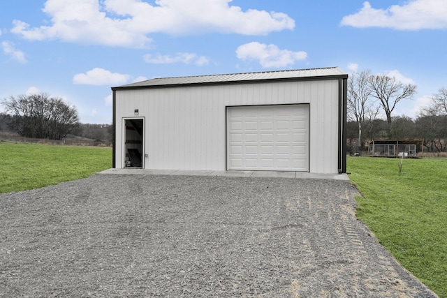 garage featuring a yard