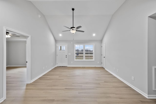 entryway featuring ceiling fan, high vaulted ceiling, and light hardwood / wood-style floors