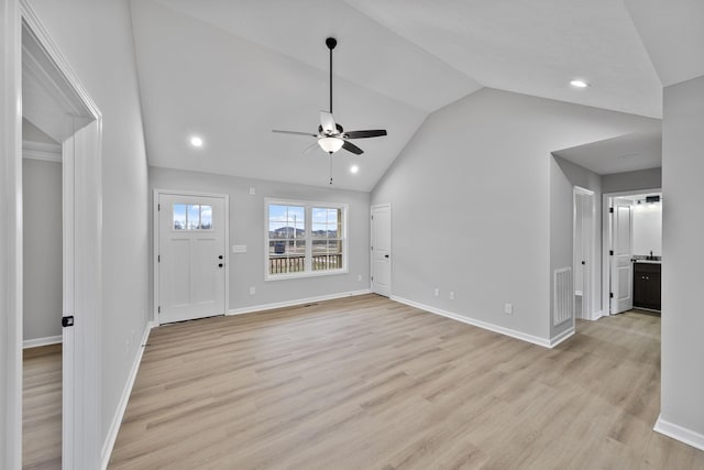 unfurnished living room with ceiling fan, lofted ceiling, and light hardwood / wood-style floors