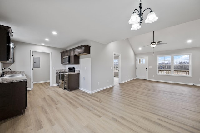 kitchen featuring stainless steel appliances, dark brown cabinets, sink, and light wood-type flooring