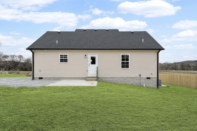 back of house with a yard and a patio area