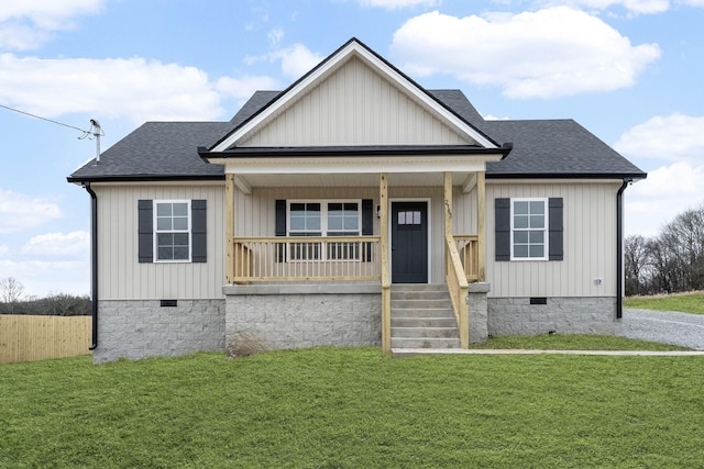 view of front of property with a porch and a front yard