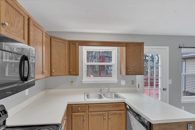 kitchen with range, dishwasher, sink, and kitchen peninsula