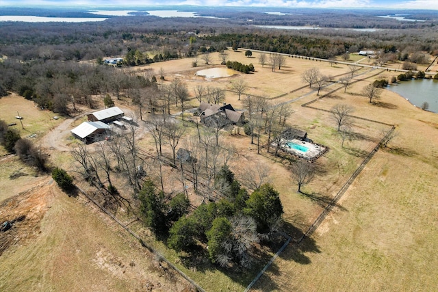 birds eye view of property with a water view and a rural view