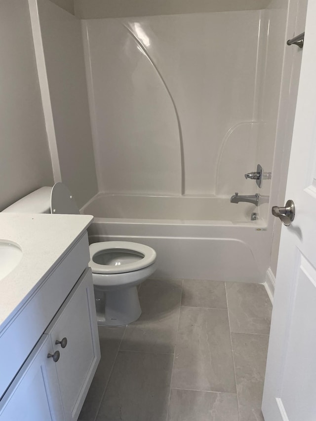 full bathroom featuring vanity, shower / bathing tub combination, tile patterned floors, and toilet