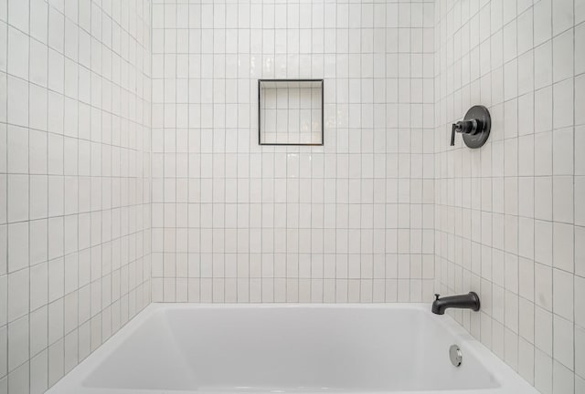 full bathroom featuring  shower combination