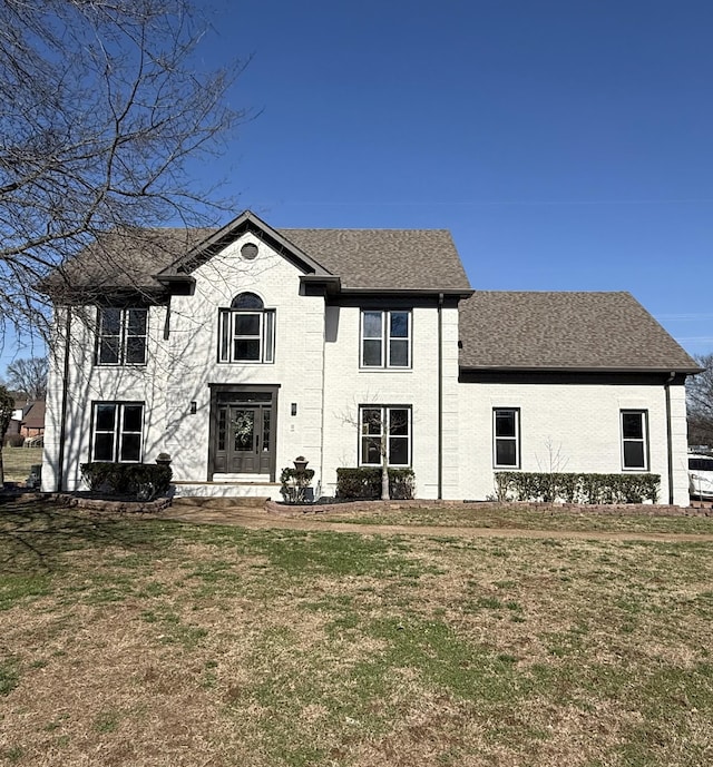 view of front of house with a front lawn