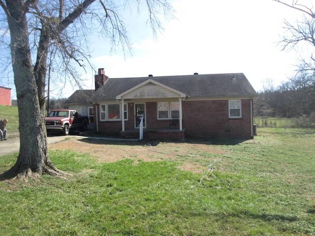 single story home with a front yard and a porch