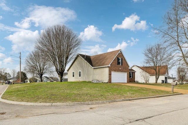 view of side of home with a garage and a yard