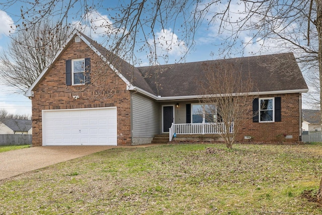 view of front of property with covered porch, a front yard, and a garage