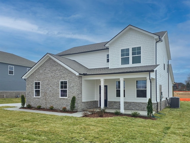 view of front of house with a front lawn, central air condition unit, and a porch