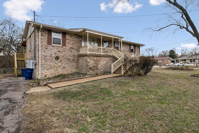 view of front of property with a porch and a front yard