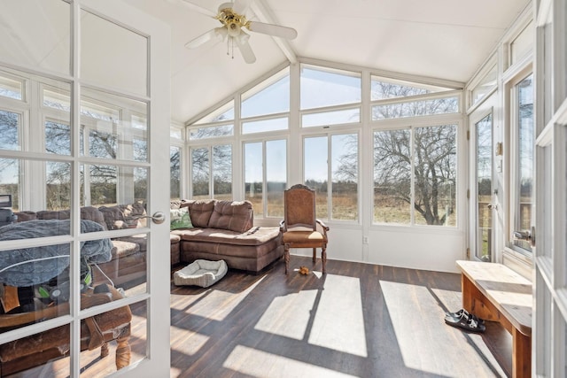 sunroom featuring vaulted ceiling with beams and ceiling fan