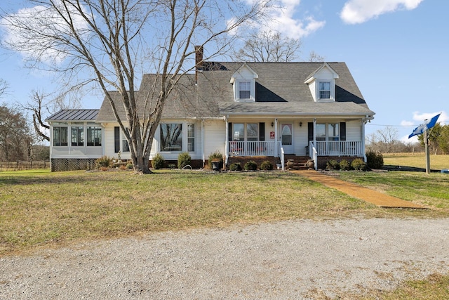 cape cod home featuring a sunroom, covered porch, and a front yard