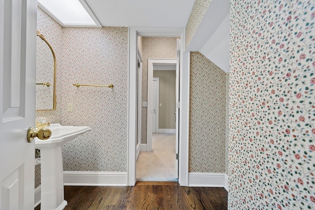 bathroom featuring wood-type flooring and sink