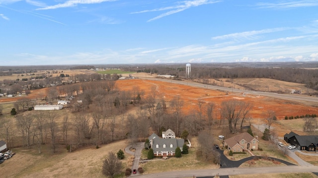 birds eye view of property with a rural view