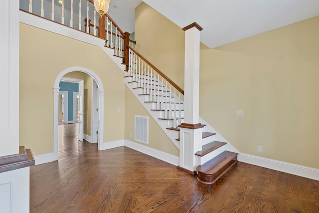 stairway featuring a high ceiling