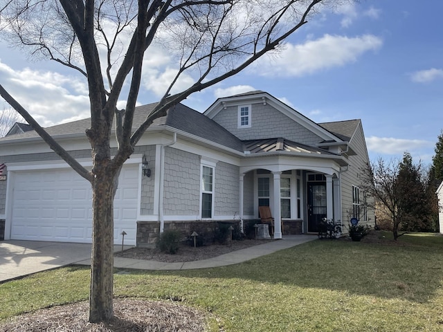 view of front of home with roof with shingles, concrete driveway, an attached garage, stone siding, and a front lawn