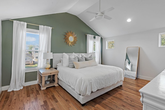 bedroom featuring hardwood / wood-style flooring, vaulted ceiling, and ceiling fan