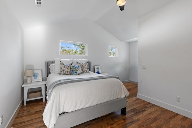 bedroom with dark hardwood / wood-style floors and vaulted ceiling