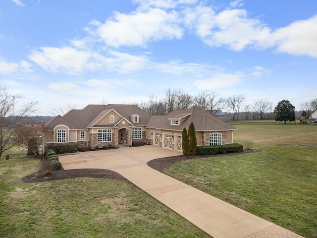 single story home featuring a garage and a front yard