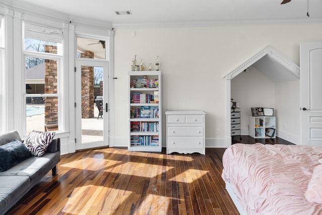 bedroom featuring ornamental molding, dark hardwood / wood-style floors, and access to outside