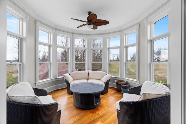 sunroom featuring ceiling fan