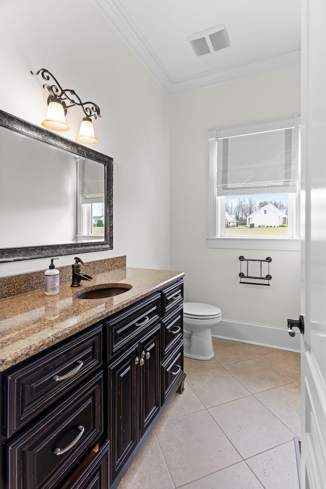 bathroom featuring ornamental molding, vanity, tile patterned floors, and toilet