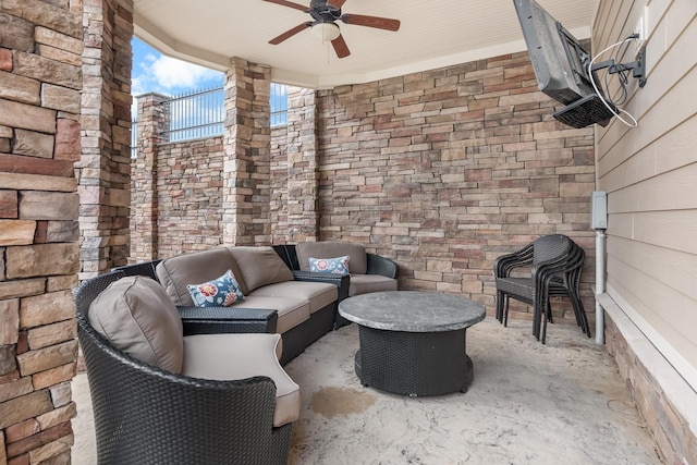 view of patio / terrace with ceiling fan and an outdoor living space