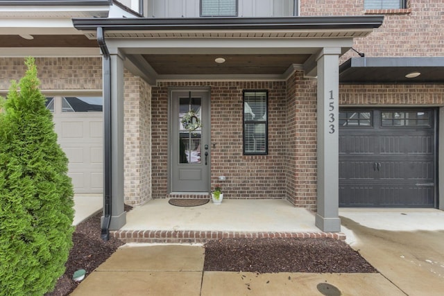 view of exterior entry with a porch