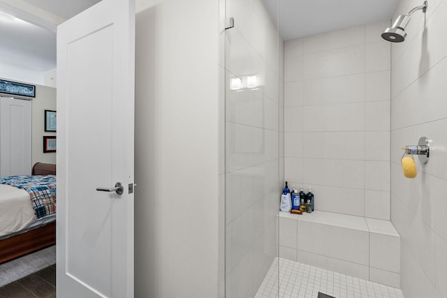 bathroom with a tile shower