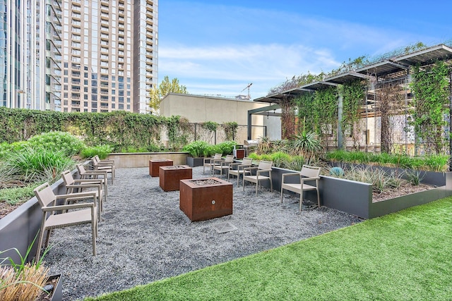 view of patio / terrace with an outdoor fire pit