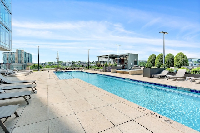 view of pool featuring a patio