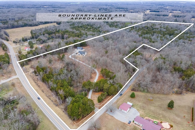 birds eye view of property featuring a rural view